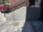 Completed split-face concrete block porch stairway rebuild in Omaha NE by Heartland Masonry.