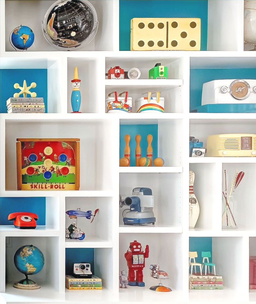 Custom built in with an amazing collecition of vintage bakelite radios, tin robots, arcade games, globes, arrows, authentic tin toys from Germany and Japan. Wooden bowling pins. Vintage childrens books and old cameras.