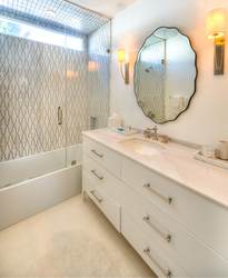 Guest Bathroom vanity has a Teodora mirror from Grandin Road.  The sconces are the Polished Nickel Colton from Hudson Valley.  The faucets are polished nickel and the sink is from Kallista.  This is an elegant bathroom for guests.