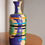 Thumbnail: Stoneware coil built and carved sculptural vessel with slip, underglaze and glazed decorative elements, from Eddie Knevett.