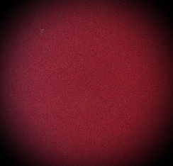 Dark red staticky circle, snuggled by dark edges.