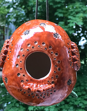 sienna carved bird back_edited.jpg