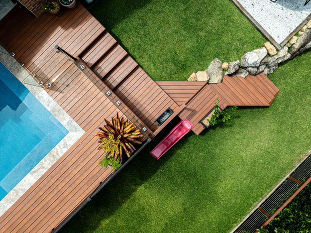 Aerial photo of backyard landscaping with pool, timber decking, garden steps, and manicured lawn — Sydney Commercial Photography.