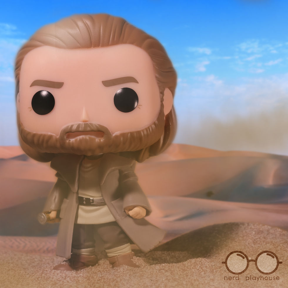 Creative toy photography of Funko POP Obi-Wan Kenobi standing in the middle of the desert (Tatooine)