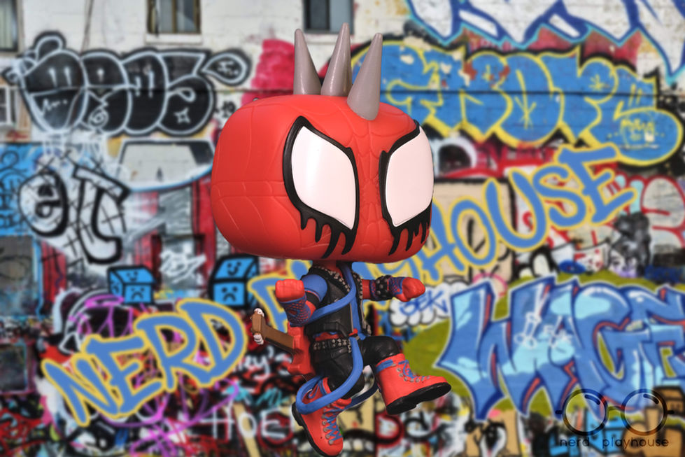 Creative toy photography of Funko POP Spider-Punk dancing in front of a colorful graffiti wall in Baltimore.