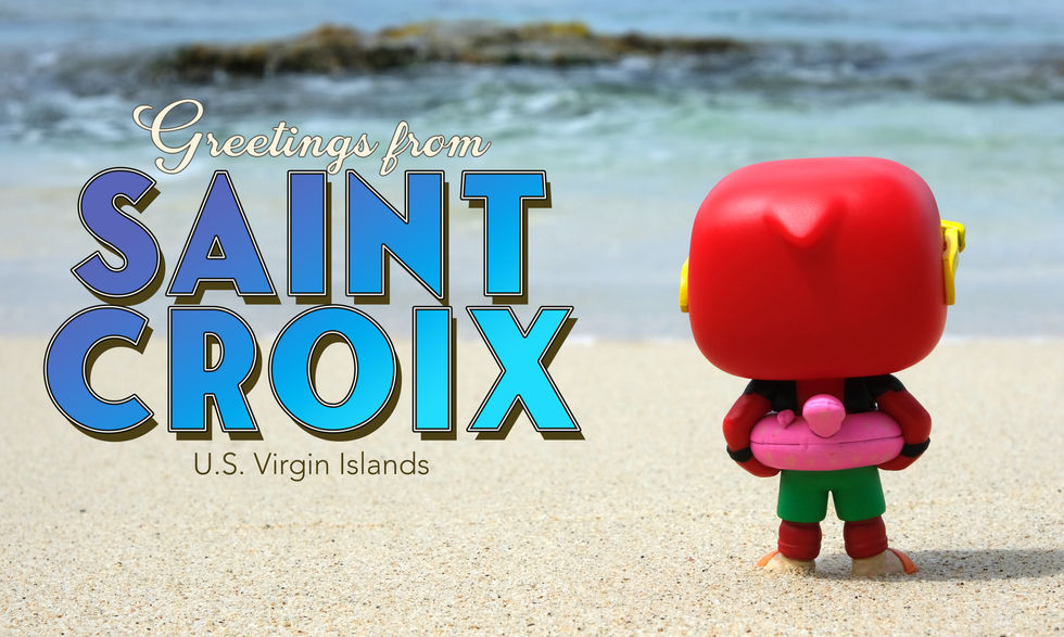 Creative toy photography of Funko POP Lazy River Deadpool appearing on a Greetings from Saint Croix postcard.