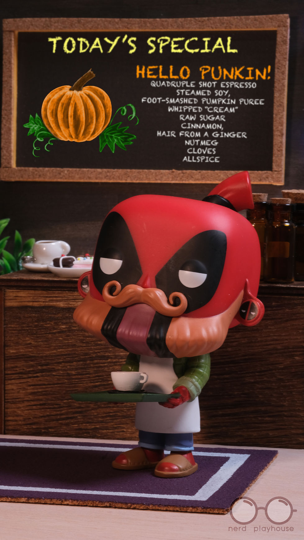 Creative toy photography of Funko POP Deadpool as a barista in a coffee shop.
