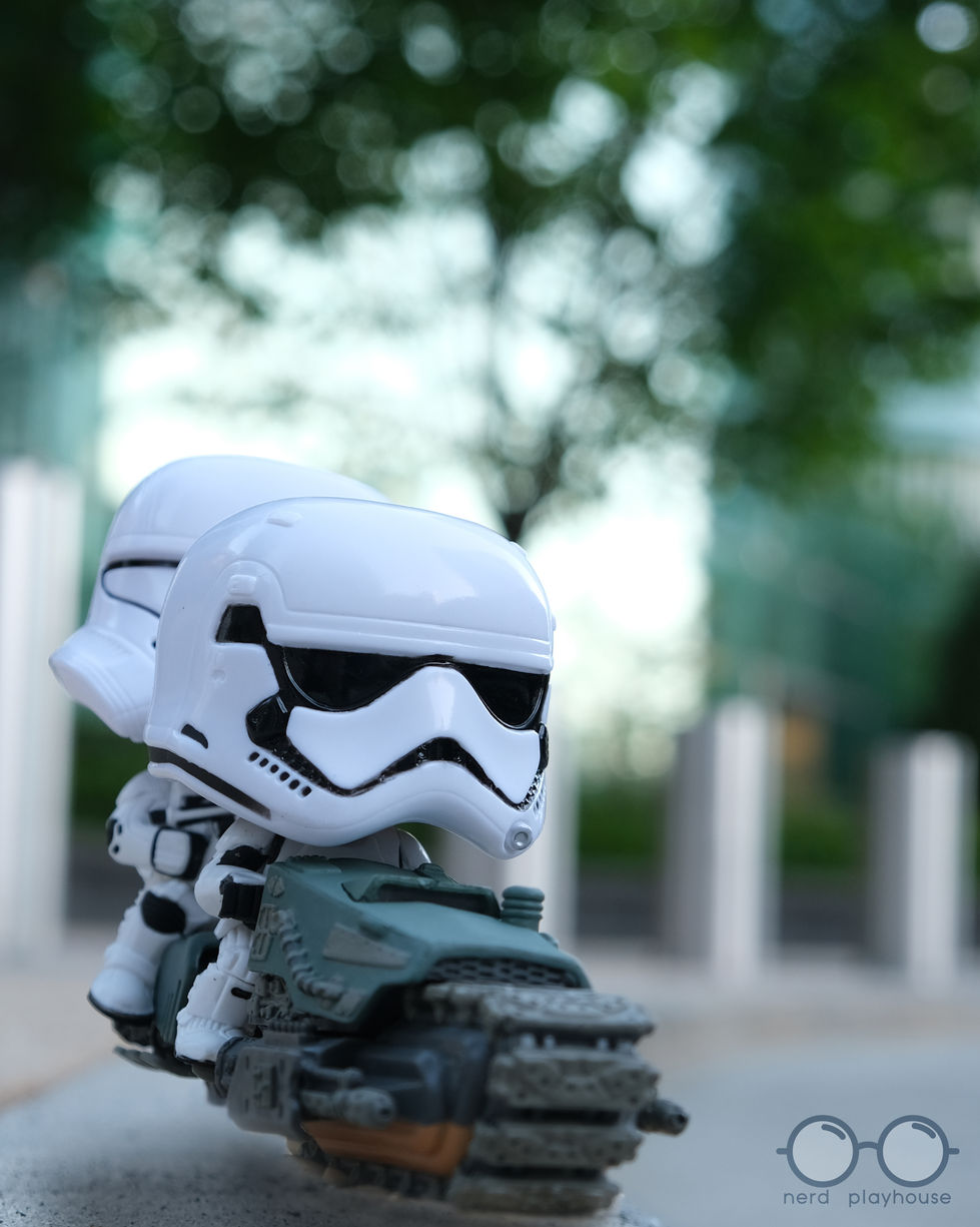 Creative toy photography of First Order troopers on their tread speeder, speeding to work.