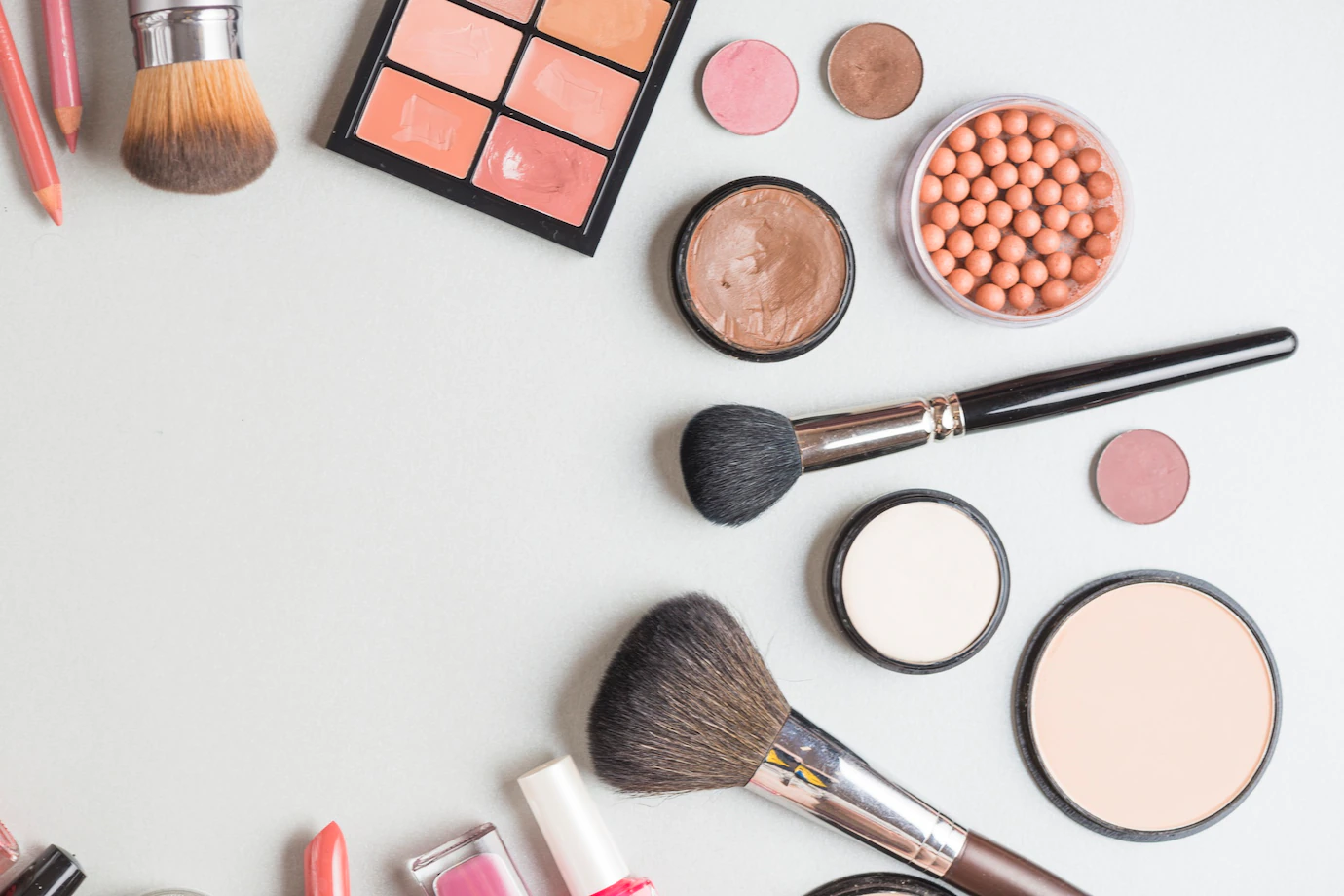 high-angle-view-cosmetic-products-white-backdrop_23-2147899548.webp