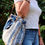 Thumbnail: Large textured blue and white raffia and wool beach style bag with leather straps & optional fabric tie. Shown with model