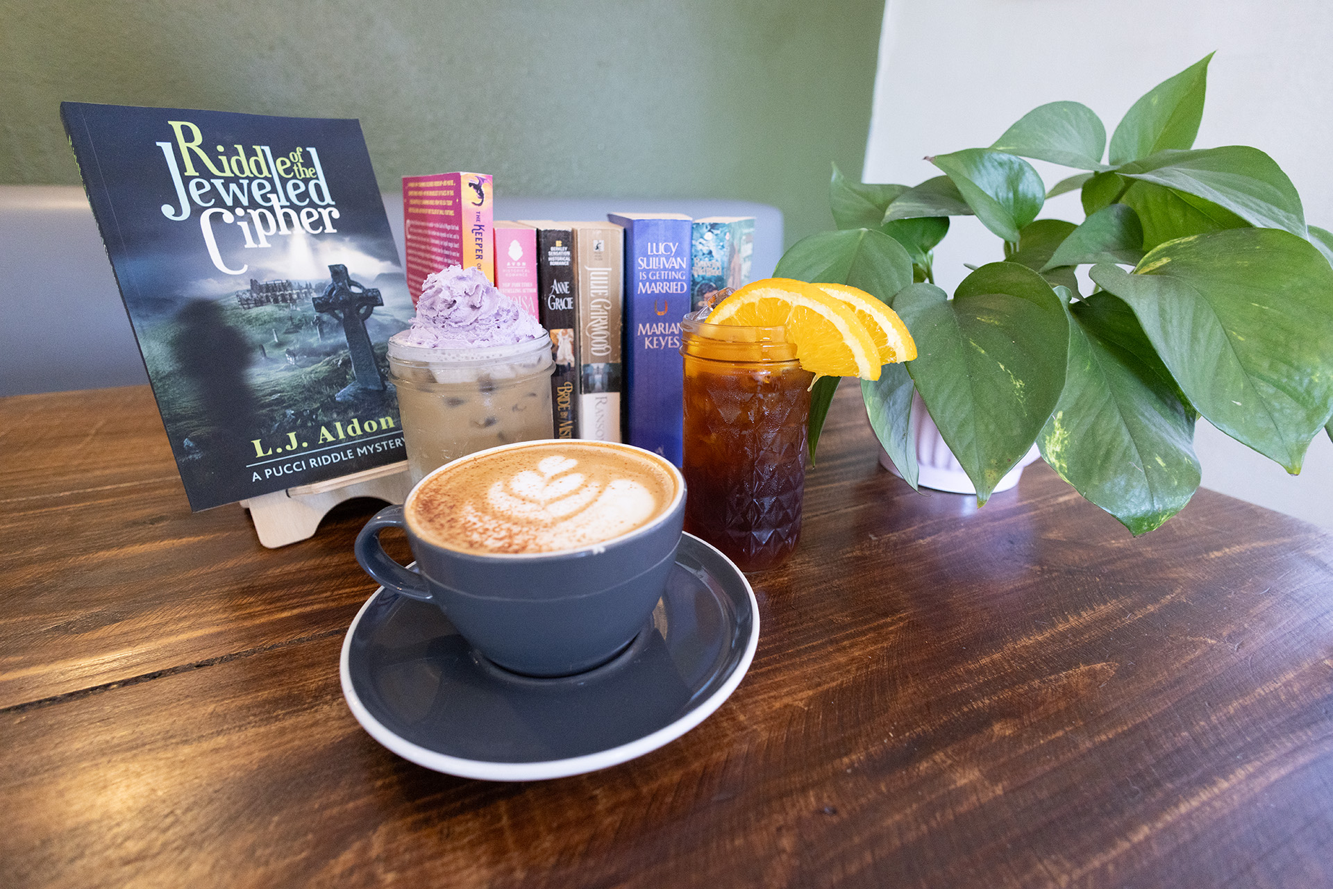 Craft coffee drinks at Michael Thomas Coffee including a latte with latte art, iced coffee, and specialty beverages