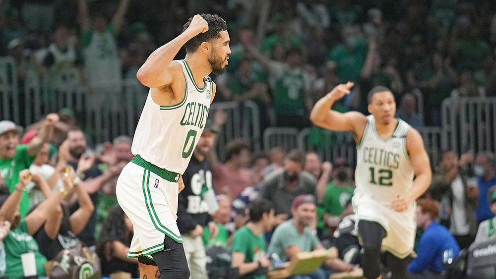 Boston Celtics forwards Jayson Tatum and Grant Williams celebrate their Game 7 win of the Eastern Conference Semifinals against the Milwaukee Bucks.