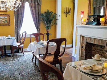 The elegant, historic dining room at the Andrew Morris House, beautifully arranged for a delicious gourmet breakfast service for guests looking for premier Historic District Lodging in Natchitoches.