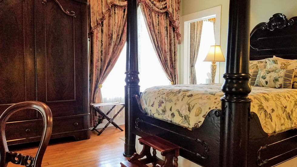 The historic Princess bedroom at the Judge Porter House Natchitoches featuring a 9-foot tall mahogany wardrobe.