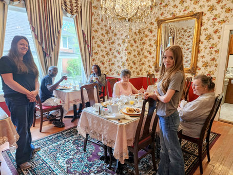 A delightful breakfast scene! Foreground: Katy, her daughter, and lifelong best friends enjoying a girls' trip. Background: Our guests Duante and Aliyah.