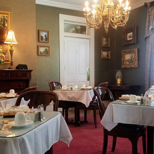 A beautifully set historic dining room table at Violet Hill Bed and Breakfast, ready for an excellent breakfast served at 8:30 AM daily