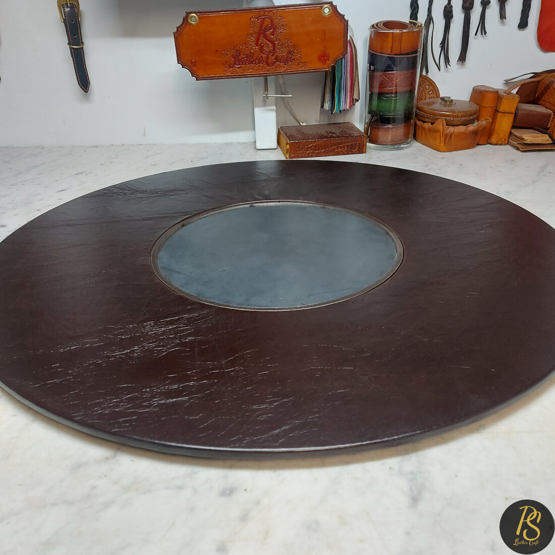 Leather edged puzzle table rings