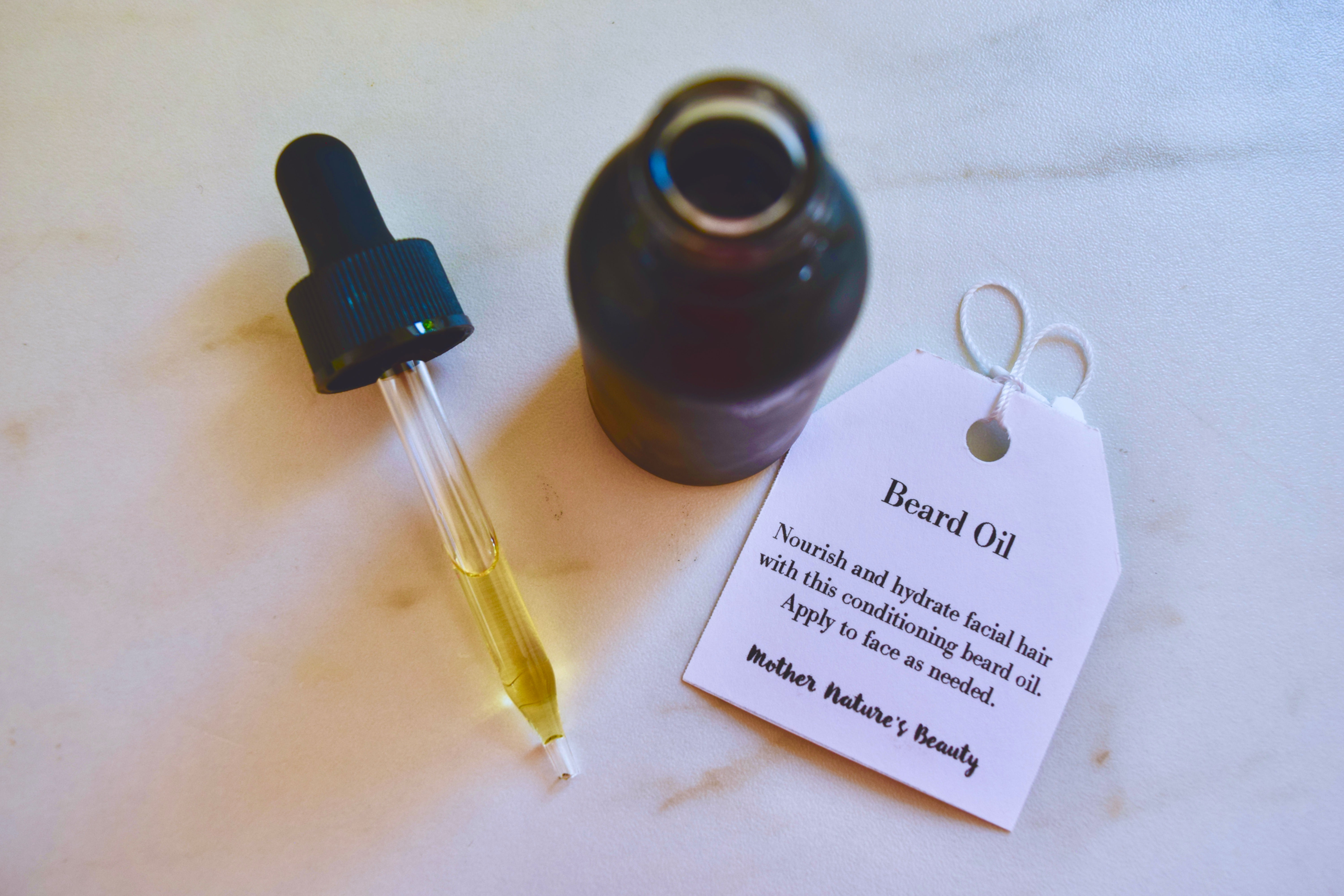 Glass bottle with dropper full of beard oil
