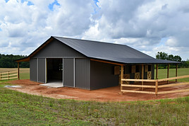 Horse barn built with post frame materials; two lean-to's, two sliding barn doors, six sta