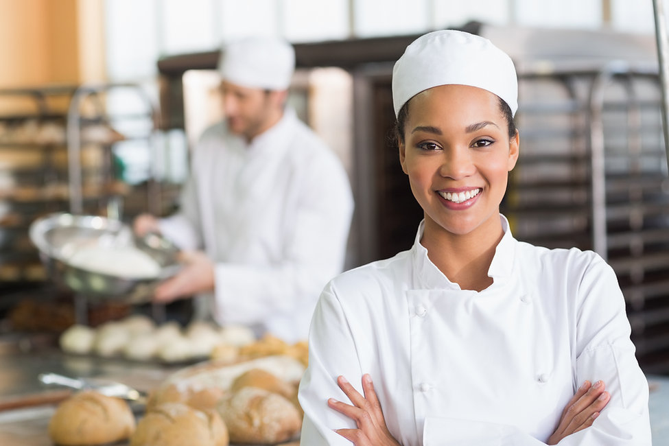 Pretty-baker-smiling-at-camera-535476743
