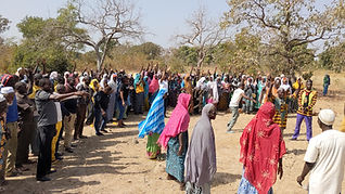 Standing on ground where the school will be built