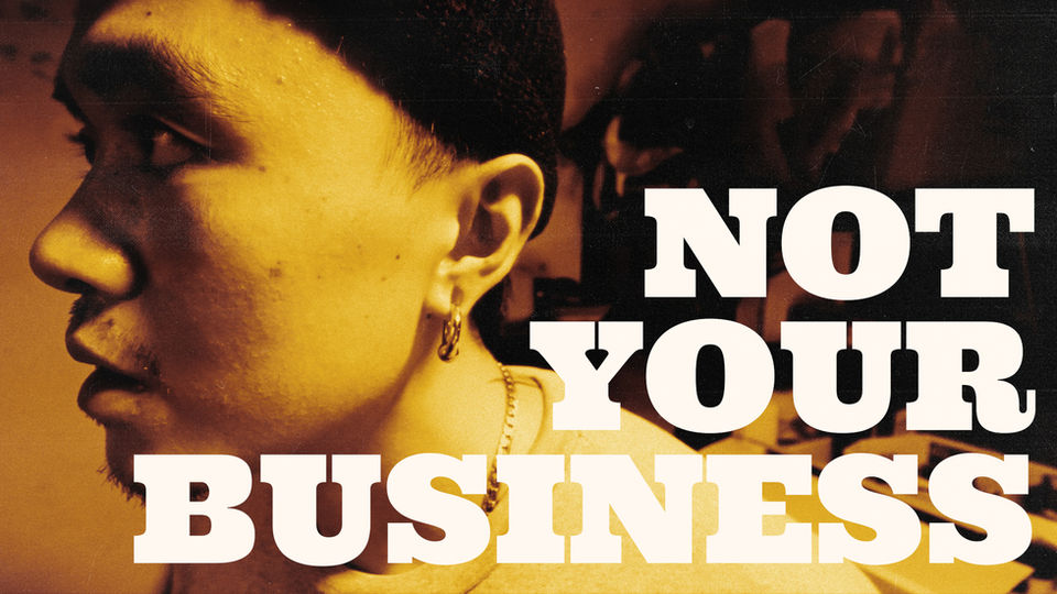close-up of a man's face with a text saying "not your business". thumbnail cover of a short film