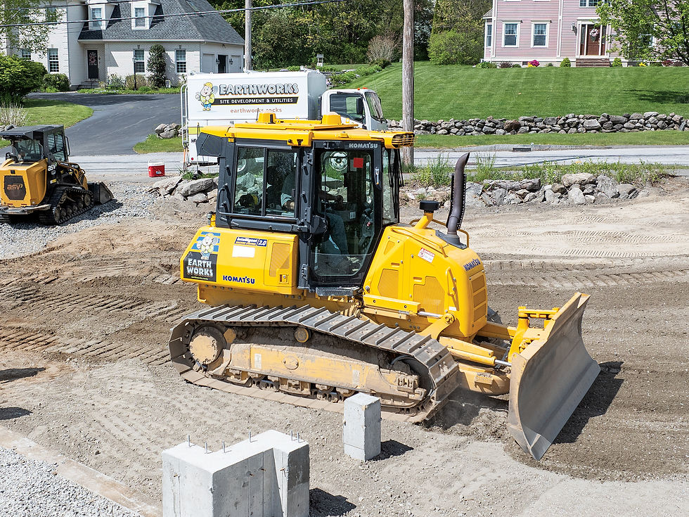 With a Komatsu D39PXi-24 Intelligent Machine Control (IMC) dozer, Christopher Etre grades a driveway entrance.