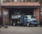 mobile mechanic truck in front of a garage.jpg