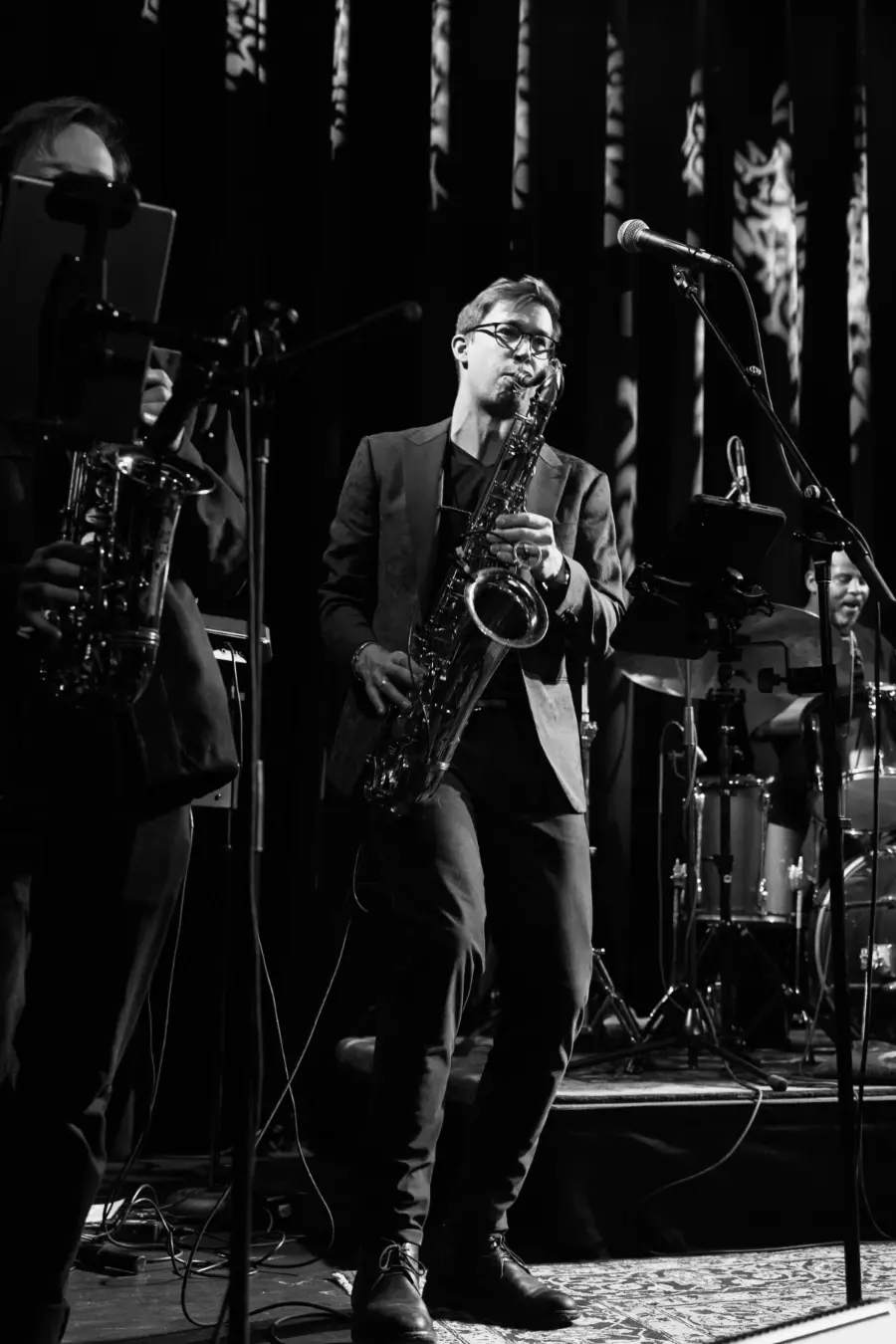 Crushville member Greg Blair playing saxophone at a show