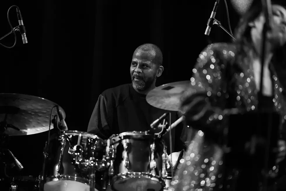 Crushville member Lil John Roberts playing drums at a show