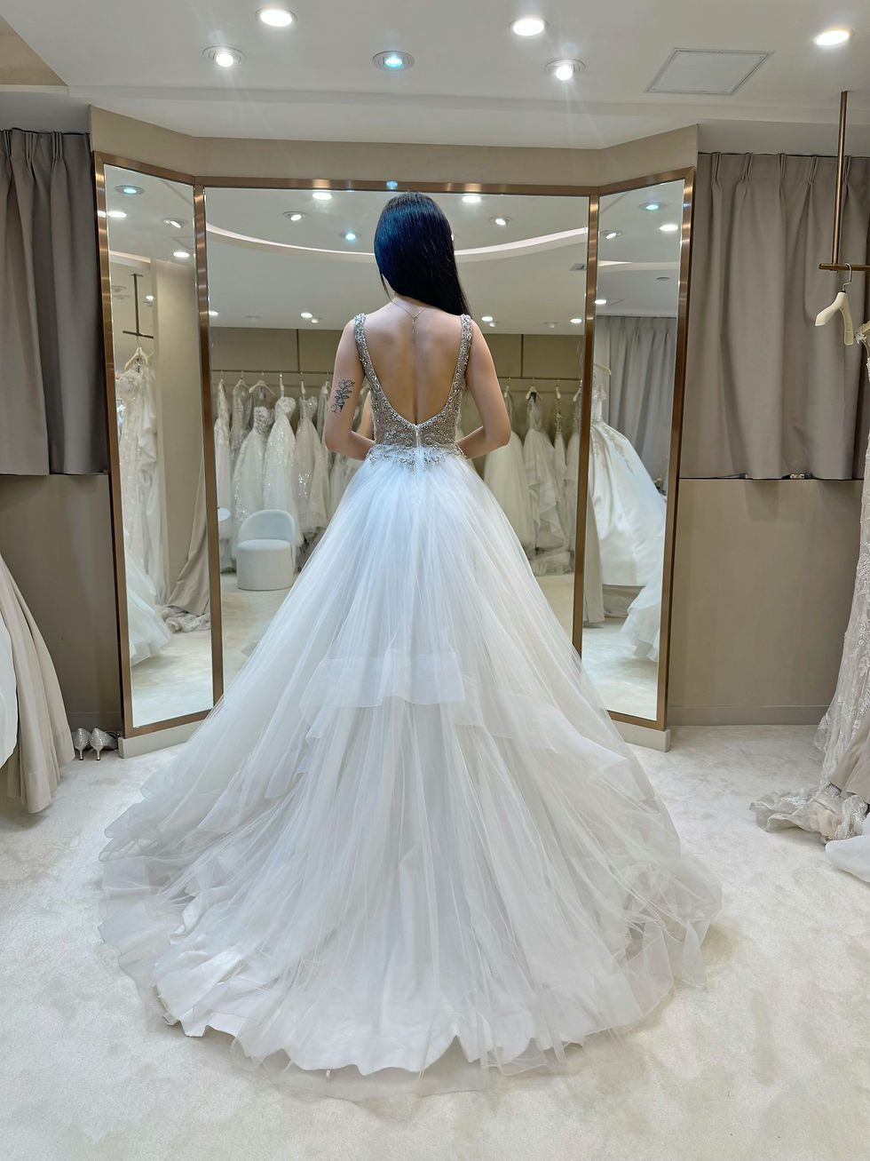 Back view of Casablanca tiered ball gown showing voluminous layered tulle skirt and crystal embellished bodice
