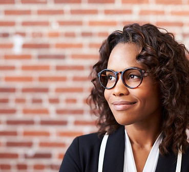 smiling-businesswoman-wearing-glasses-standing-aga-2026-01-05-06-27-41-utc.jpg