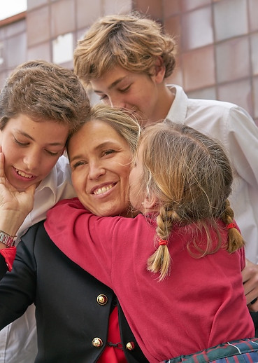 happy-family-embrace-in-front-of-tile-wall-2026-03-17-21-37-31-utc.jpg