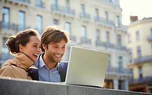 a-smiling-man-and-woman-looking-at-a-laptop-screen-2026-03-25-00-55-09-utc.jpg