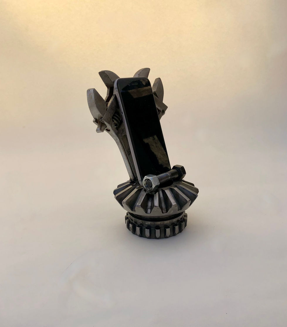 Metal phone or card holder made from a gear and 2 adjustable wrenches