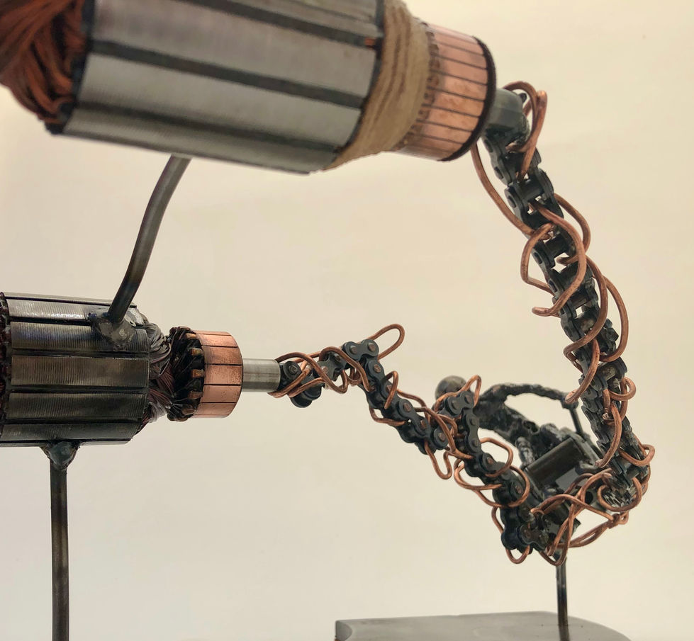 Close up of a steampunk style pod racer showing bike chain, copper wire and electric motors