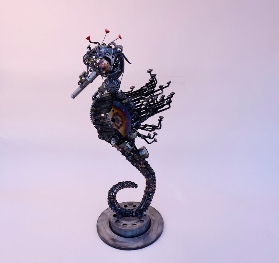 steampunk style seahorse made from chains, gears and old typewriter parts