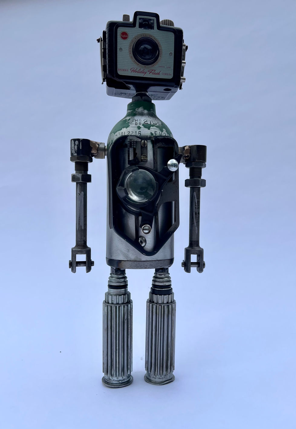 Robot with a Kodak Brownie camera for the head and medical oxygen tank for the body