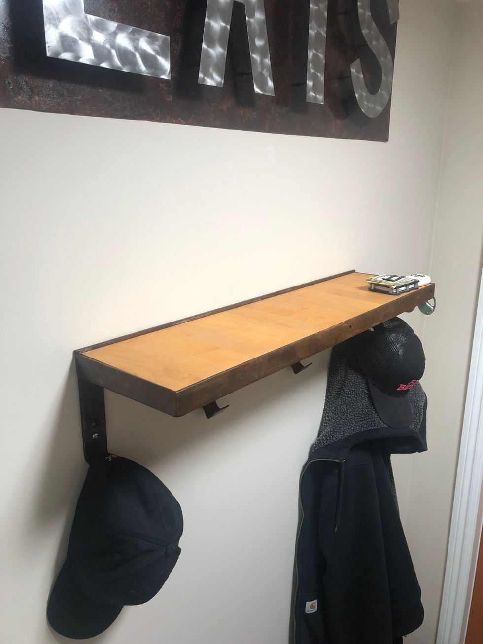 Mudroom shelf with coat and hat hooks, made from leftover counter top and scrape metal