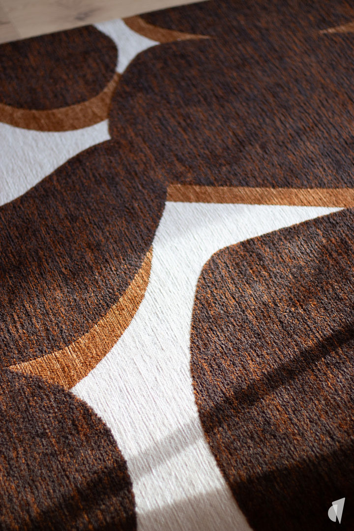 Rénovation et décoration d'un appartement chaleureux à Meythet par l'architecte d'intérieur Coralie Vasseur : formes organiques pour ce tapis de salon