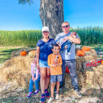 family at pumpkin patch