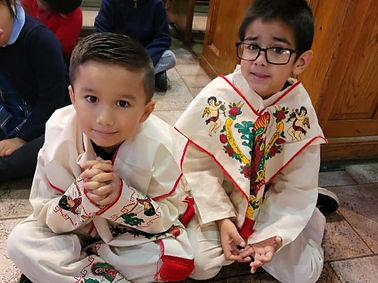 two male students sitting in church