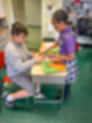 Two students working at a desk