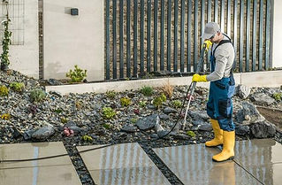 man-pressure-washing-concrete-tiles-photo.jpg