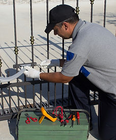 Electrician at work with tools of the trade while assembling and repairing the motor of an