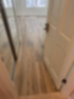 Newly installed wide-plank flooring in a refreshed interior room, demonstrating our professional surface restoration and property maintenance standards. For flooring updates or room turnovers, call Solano Property Maintenance at 626-344-0337