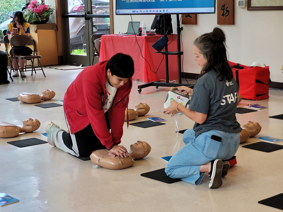 BLIA North Carolina Young Adult Division member Lomen volunteers as a demonstration participant, assisting the instructors with a CPR demonstration. (Photo by Jasmine Lang)