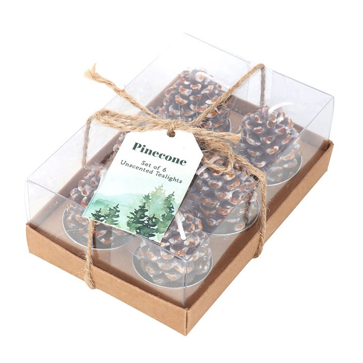 charming gift box containing 6 fir tree pine cone shaped cables tea lights. christmas themed with snow tipped pine cones