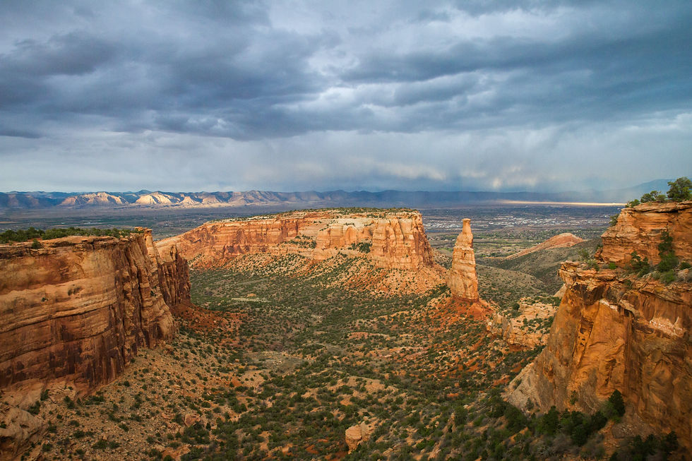 High angle view of Grand Junction's diverse landscape with mountains and clear skies