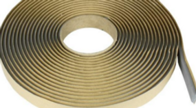 Roll of butyl caulking tape used to create weather-resistant seals between steel building panels.